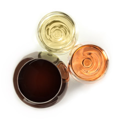 Three glasses of wine on white, overhead photo