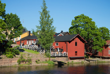 Fototapeta na wymiar A view of summer cafe on the river bank of Porvoyoki in the old city porvoo