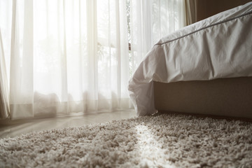 beige color domestic carpet texture with light spot from window