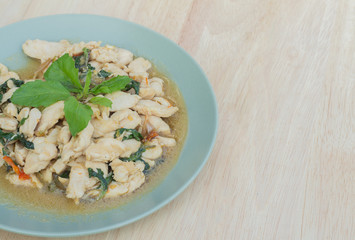 Spicy fried chicken with basil leaves