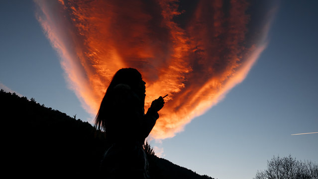 Girl smoking with a red cloud