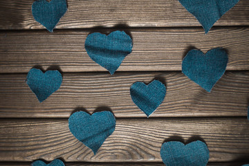 Obraz premium Valentine's day. wooden background with blue hearts.the photo ha