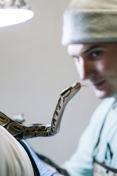 Man looking at snake