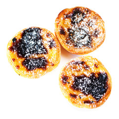 Typical portuguese dessert pasteis de nata / Heap of egg tarts i