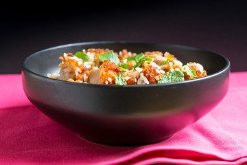 Homemade Chinese fried rice with vegetables and fried eggs