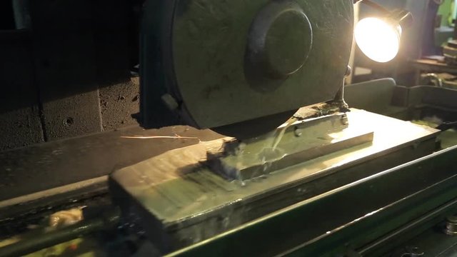 Process of cutting topsheet of billet by tool on mill.