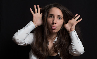 Pretty young girl show emotions isolated on black