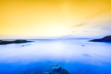 Naklejka na ściany i meble sunrise on the coast of Ireland, Portmarnock. Toned image