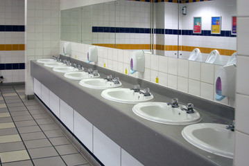 Fototapeta na wymiar Inside a modern mens washroom.