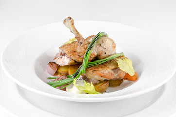 Chicken ham with crispy caramel crust and onions on a plate on a white background