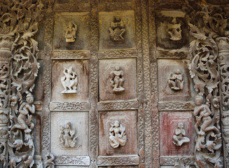 Decoration wood carving door in the temple in Myanmar.
