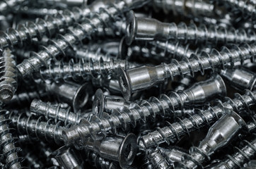 Metal furniture bolts. Background close-up