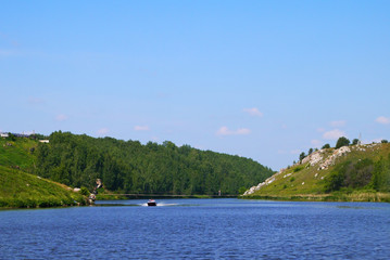 Fototapeta na wymiar Rocky river reversal. Iset river, on the border of the city Kamensk-Uralskiy. Iset river, Kamensk-Uralskiy, Sverdlovsk oblast, Russia.