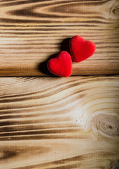Happy Valentine's Day. Two red hearts on wooden background. Love