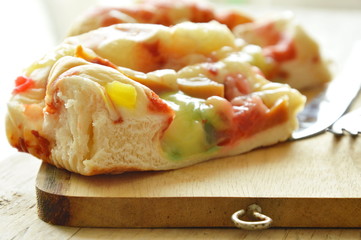 pork sausage bread with mayonnaise and butter on wooden chop block