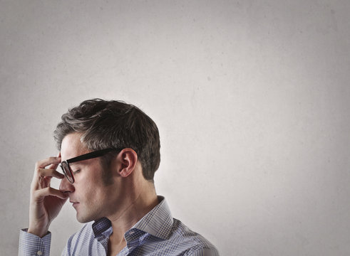 Man in glasses concentrates