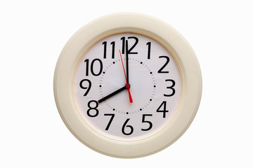 White analog wall clock showing eight o'clock