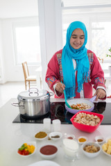 Young Muslim Arabic woman in the kitchen