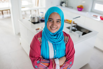 Young Muslim Arabic woman in the kitchen