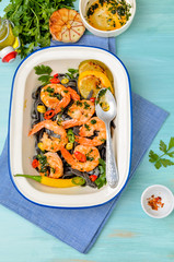 whole grain spaghetti pasta with shrimps and broccoli, top view,