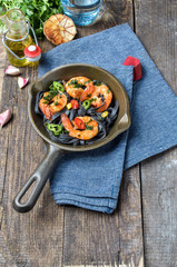 whole grain spaghetti pasta with shrimps and broccoli, top view,