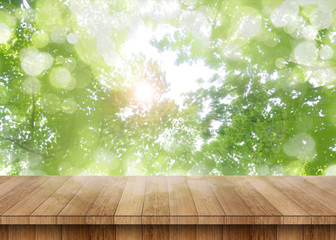 Wood table perspective with green leaf