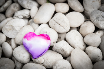 Heart on pebble stones, Valentine's Day background