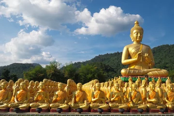 Wall murals Buddha Buddha image of Lord buddha among the 1,250 monks, the symbol of Magha Puja day, Buddha Memorial park, Nakorn nayok, Thailand