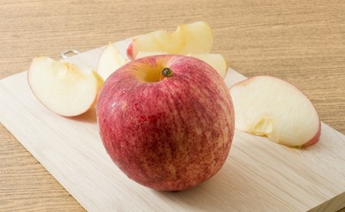 Fresh Ripe Red Apple on Wooden Tray