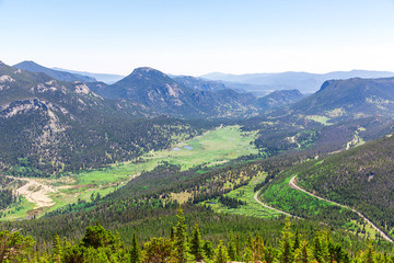 Fototapeta na wymiar Landscape of valley with evergreen mountains