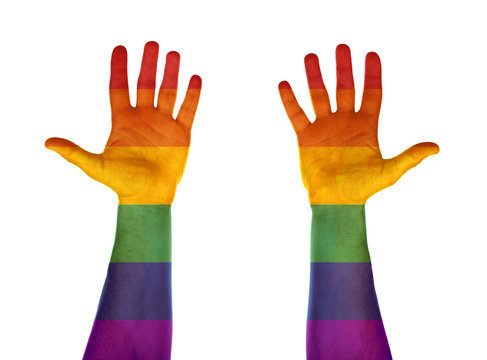 Male hands painted in LGBT flag on white background