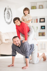 Fototapeta premium Happy father and kids at new modern home