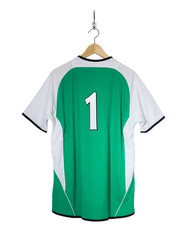 Green Football shirt hanging on hook and isolated on white