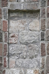 Stone wall with slot to insert e.g. a plate