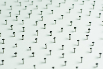 Obraz premium Group of Concrete nails Galvanized dip color on white paper back