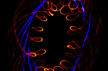 Light spiral, red and blue lines on a black background