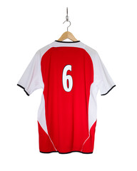 Yellow Football shirt hanging on hook and isolated on white