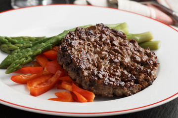 Beef burger with vegetables closeup