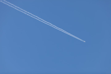 Airplane on blue sky