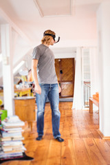 Young Man In His Apartment, Using Vr Glasses