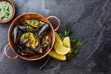 Peel and stick wall murals Sea Food Mussels in copper bowl, lemon, herbs sauce and white wine.