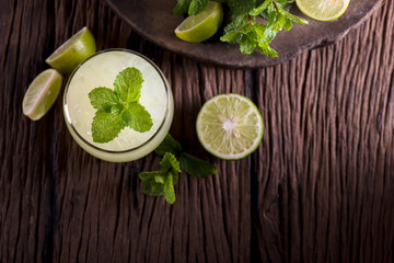 lemon juice on wooden background.