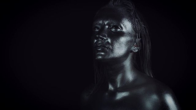 4K Horror Woman with Silver Metallic Make-up Posing like Statue
