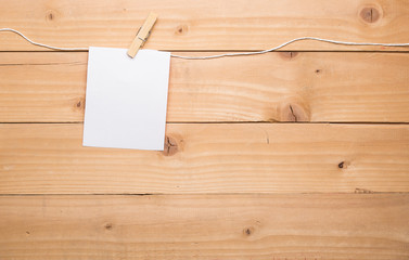 white blank note card hanging from clothesline