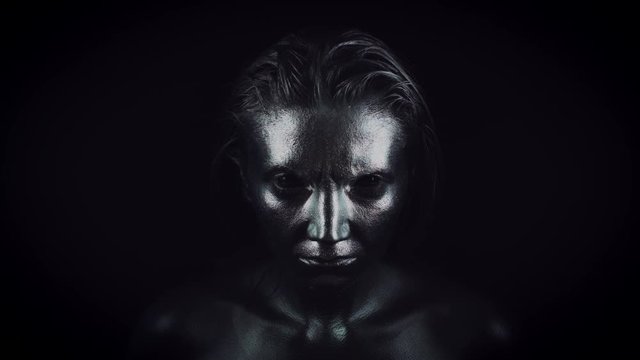 4K Horror Woman with Silver Metallic Make-up Appearing from Darkness