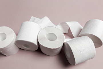 Toilet paper on pink background