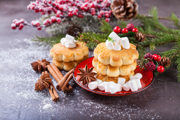 cookies about marshmallows and Christmas balls on a table, selective focus, copy space