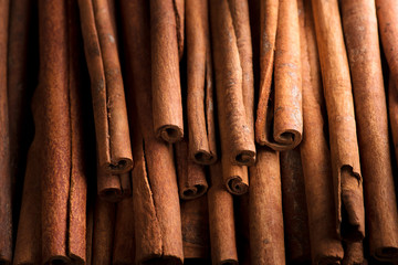 cinnamon sticks background, selective focus.