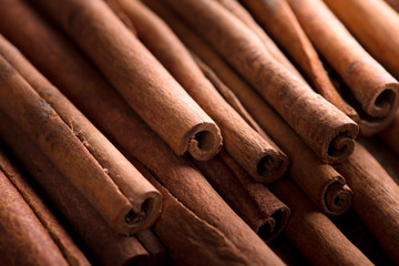 cinnamon sticks background, selective focus.