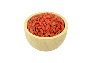 goji berries in wood bowl isolated on white background